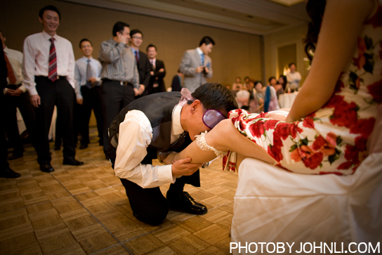 wedding photos in Pacific Palm reception garter toss game 